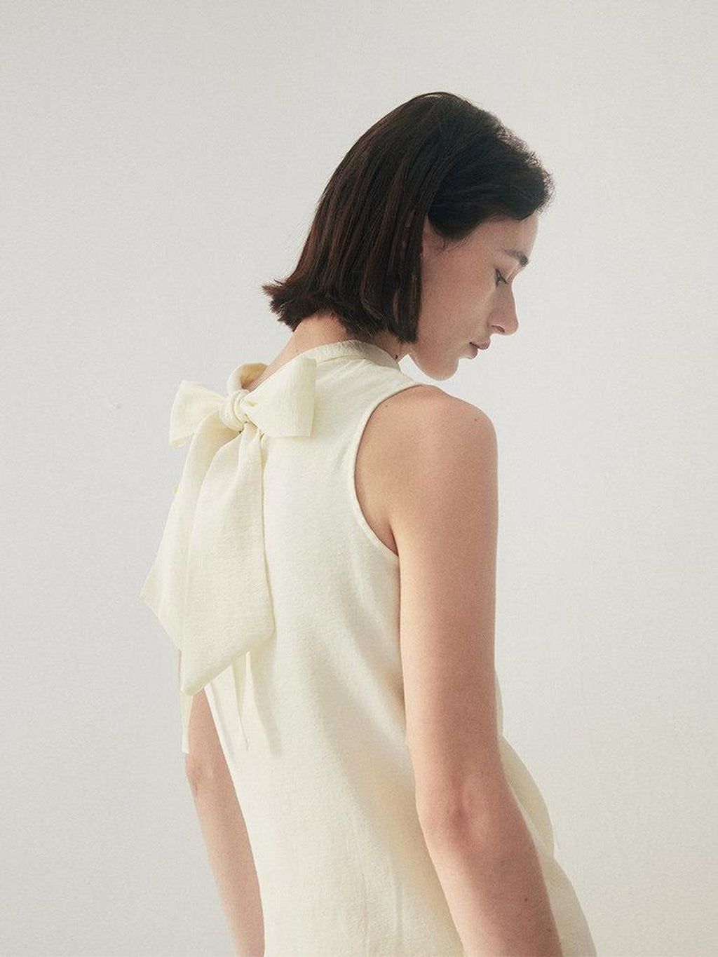 someone sometimes Original Slim Tie Detail Stand Collar Sleeveless Cream Pullover Top & Skirt Sets